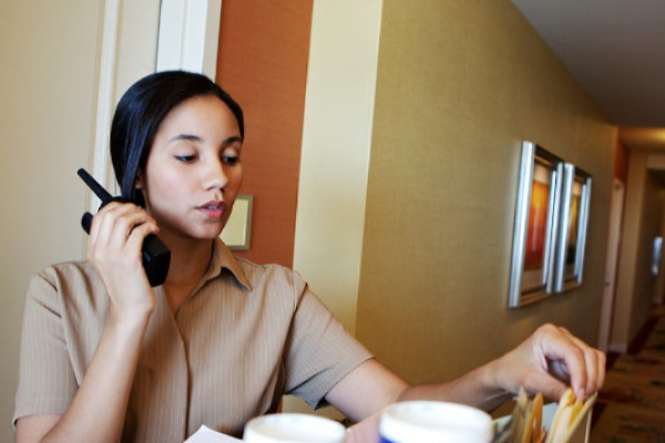 hotel-staff-using-walkie-talkie